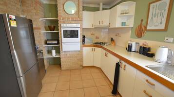 Fridge, microwave, oven, cookware/dishes/utensils