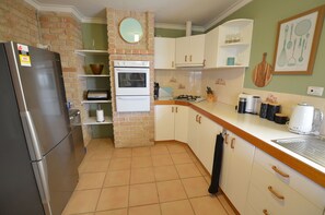 Fridge, microwave, oven, cookware/dishes/utensils