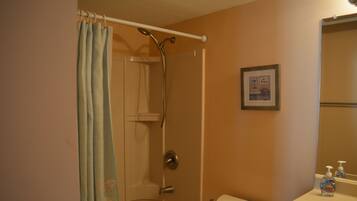 Combined shower/tub, hair dryer, towels, soap