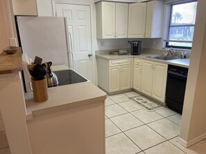 Microwave, dishwasher, coffee/tea maker, cookware/dishes/utensils