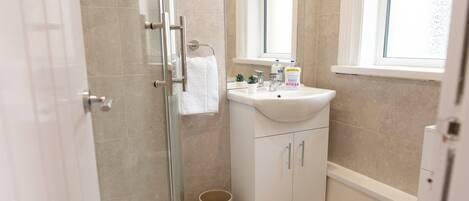 Shower, hair dryer, towels, soap