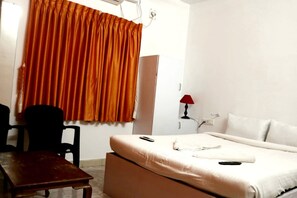 Hypo-allergenic bedding, down comforters, desk, blackout drapes