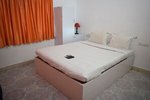 Hypo-allergenic bedding, down comforters, desk, blackout drapes
