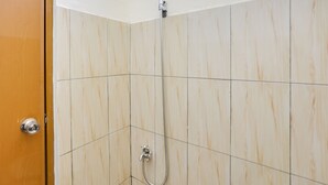 A shower with a handheld showerhead and a wall-mounted faucet. - Spot ON 3993 Zidney 2 Syariah (Salatiga)