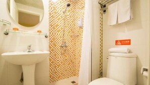 A bathroom with a sink, toilet, and shower area. - Home Inn Hotel Beijing Huoying Subway Station (Beijing)