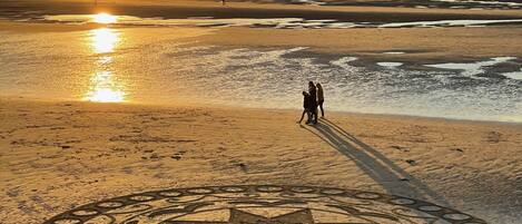 On the beach, sun-loungers