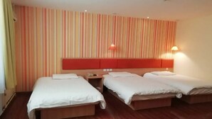 A hotel room with two beds, a red headboard, striped wallpaper, and a wooden floor. - Home Inn Hotel Beijing Capital Airport No.3 Terminal (Beijing)