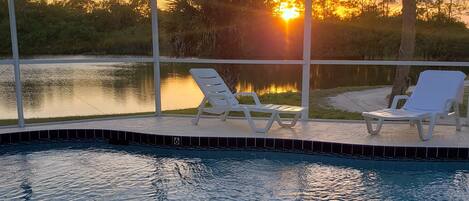 A heated pool, sun loungers