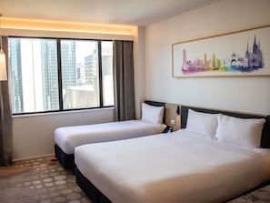A hotel room with two beds, a cityscape view, and a painting on the wall. - Ibis Melbourne Central (Melbourne)