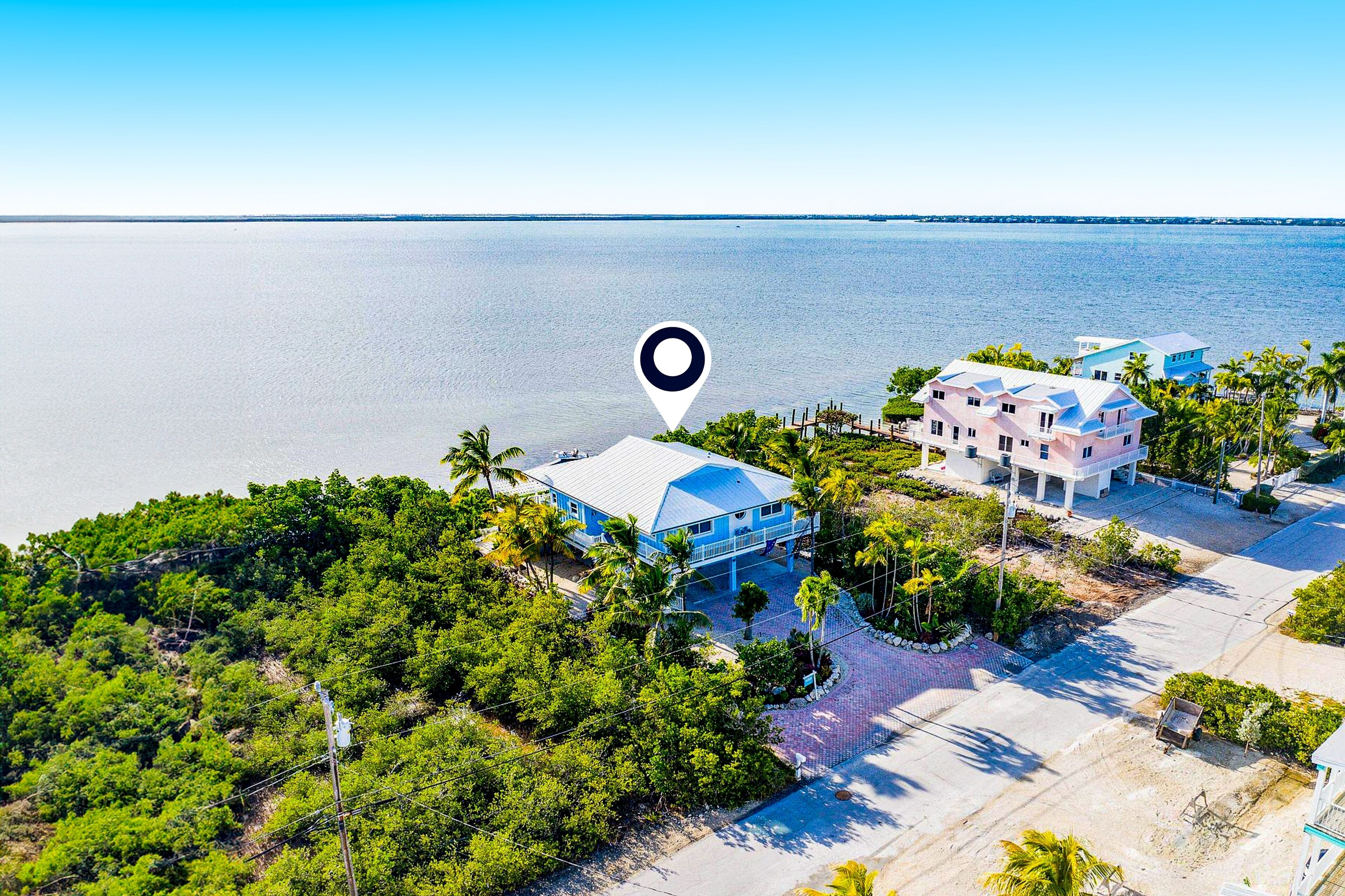 Amazing waterfront home with private beach, dock, pool, WiFi & outdoor kitchen