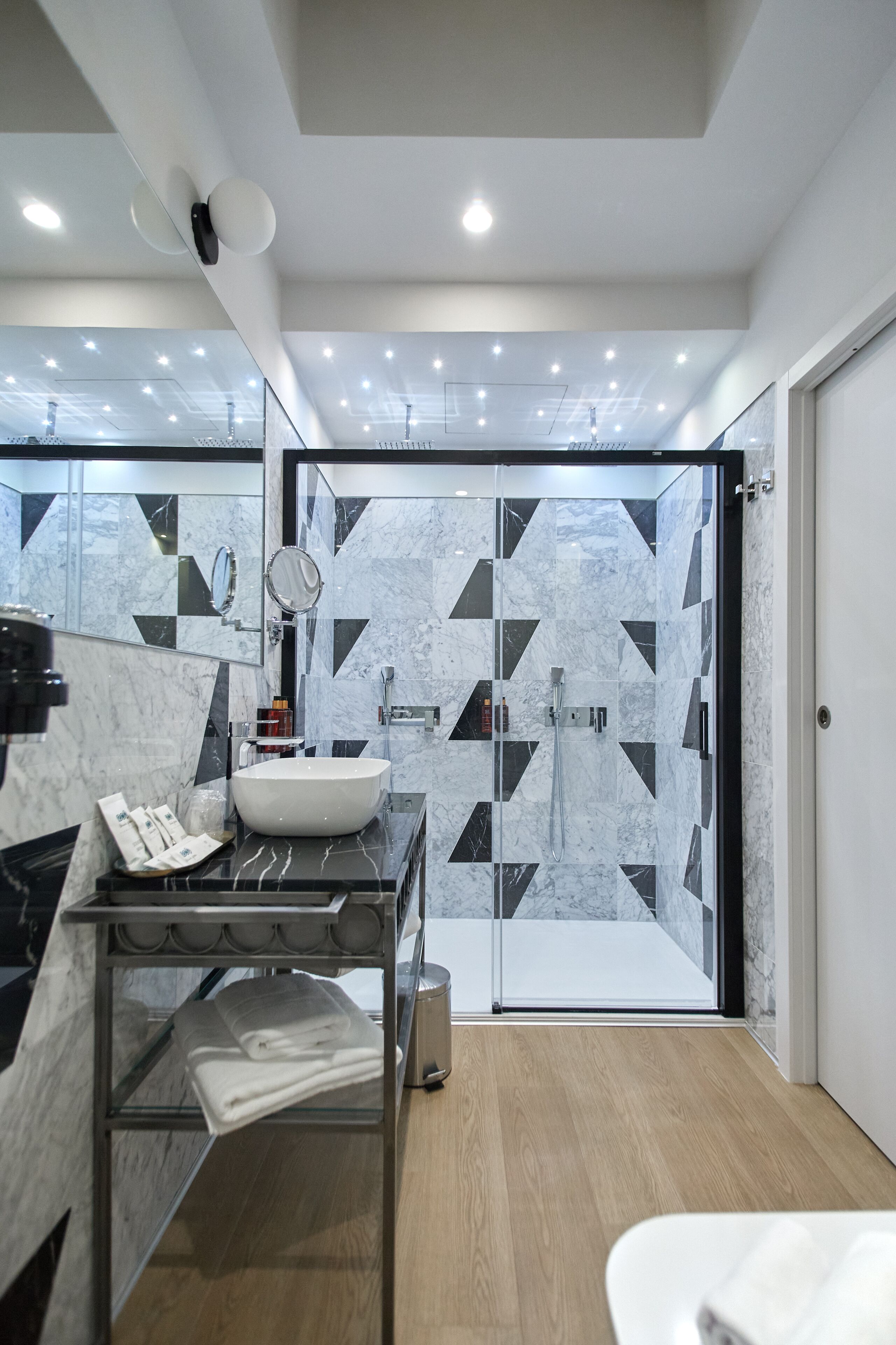 deluxe studio suite | bathroom | hair dryer, bidet, towels