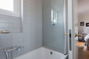 Combined shower/bathtub, hair dryer, bidet, shampoo