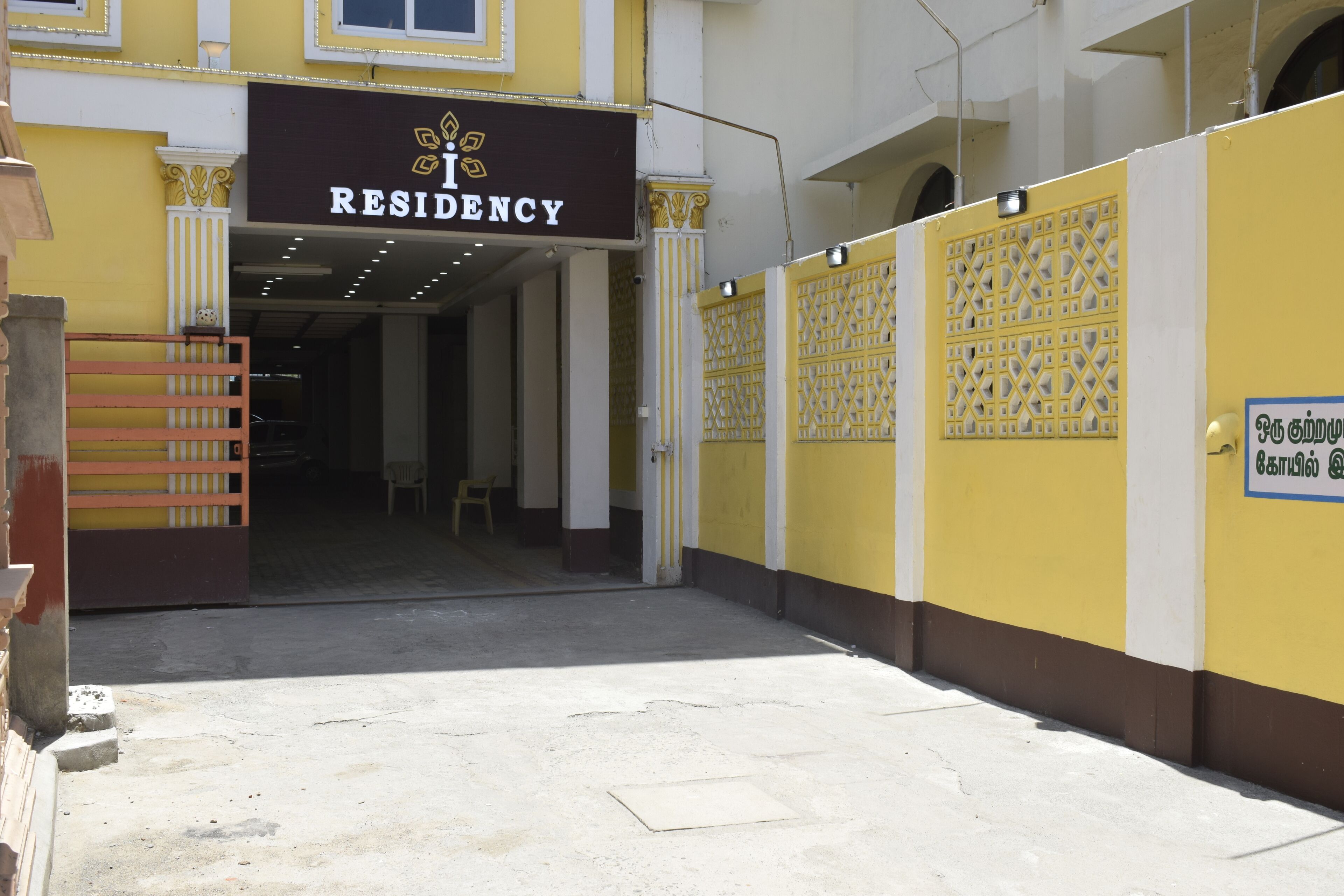 A building entrance with a sign reading "RESIDENCY".