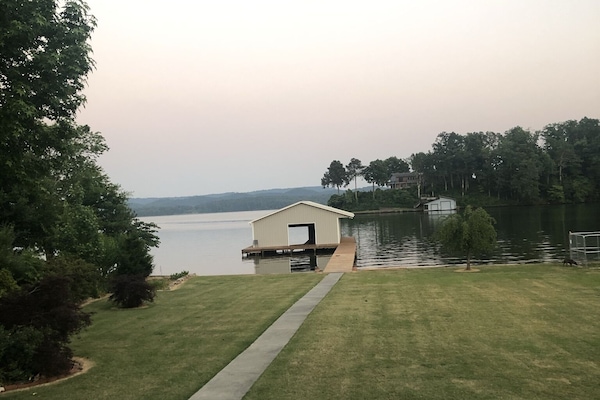 Looking form porch across the yard to the Boathouse.