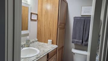 Combined shower/bathtub, hair dryer, towels, soap