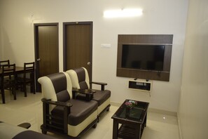 Egyptian cotton sheets, premium bedding, desk, laptop workspace - Viswa Residency by Azalea (Madurai)