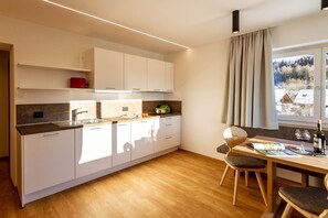 Fridge, stovetop, dishwasher, coffee/tea maker