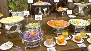A buffet with various dishes labeled, including cress, red cabbage, shrimp salt, and more. - Elephants Hotel Buon Ma Thuot (Buon Ma Thuot)