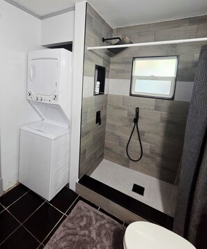 Combined shower/tub, hair dryer, towels, soap