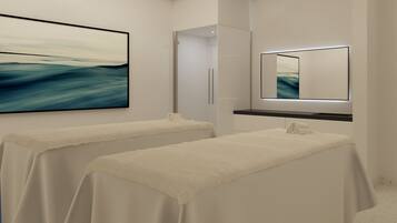 Relax in a serene space with two massage tables, a large abstract painting, and a skylight above.