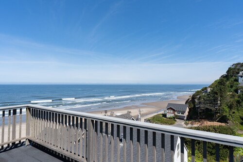 Steps to the sand, enjoy time at the beach or sweeping ocean views from the deck