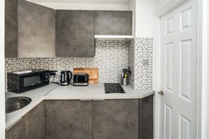 Departamento (0 Bedroom) | Cocina privada | Microondas y horno