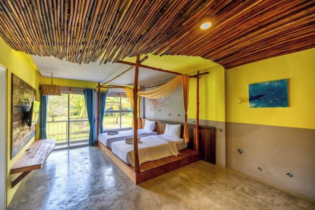 A room with a four-poster bed, a large window with curtains, and a painting on the wall.