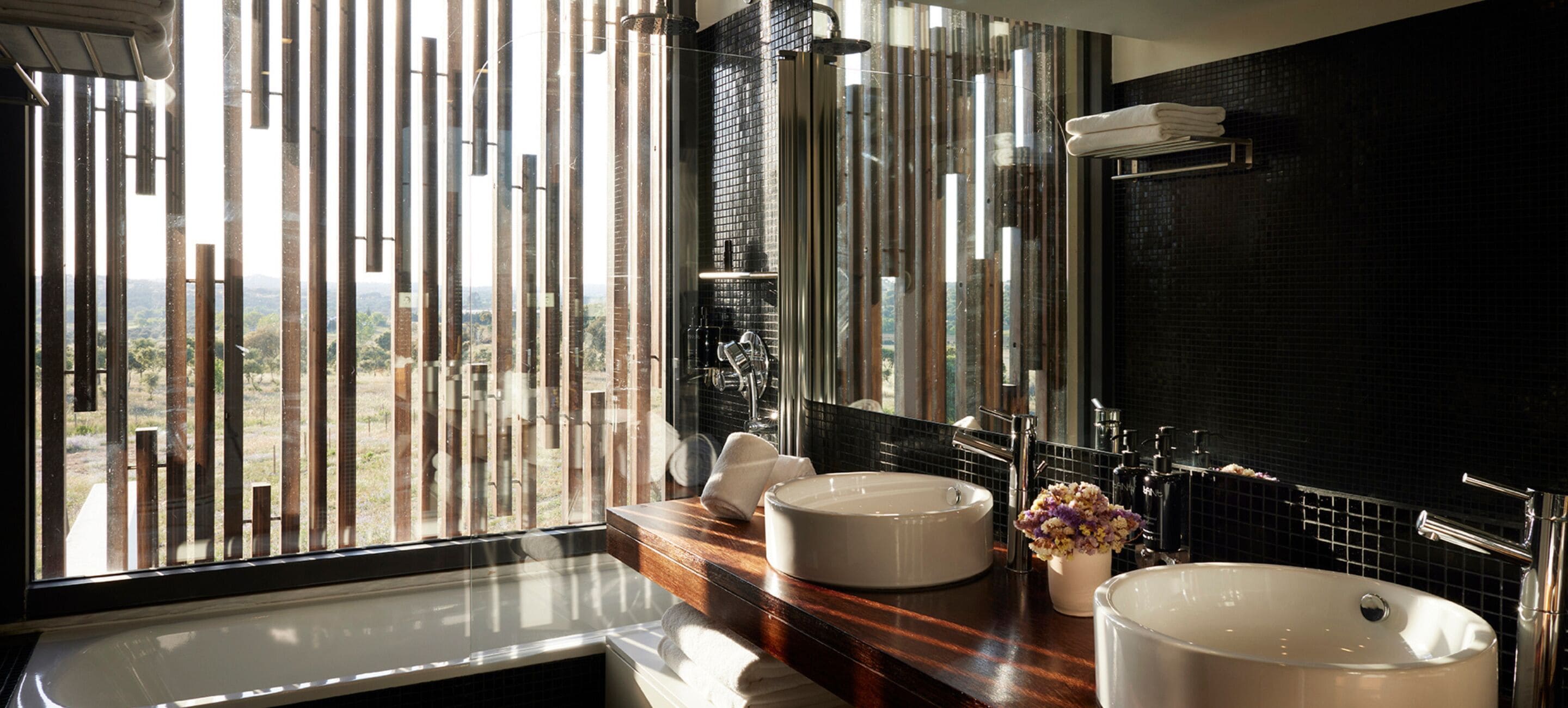 bathtub, hair dryer, bathrobes, slippers