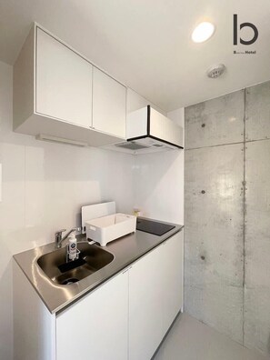 Fridge, microwave, stovetop, electric kettle - b hotel Neko Yard | Modern City-Center Studio (Naka Ward, Hiroshima)