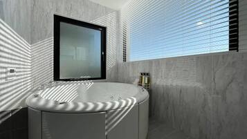 Bathtub, hair dryer, towels, soap