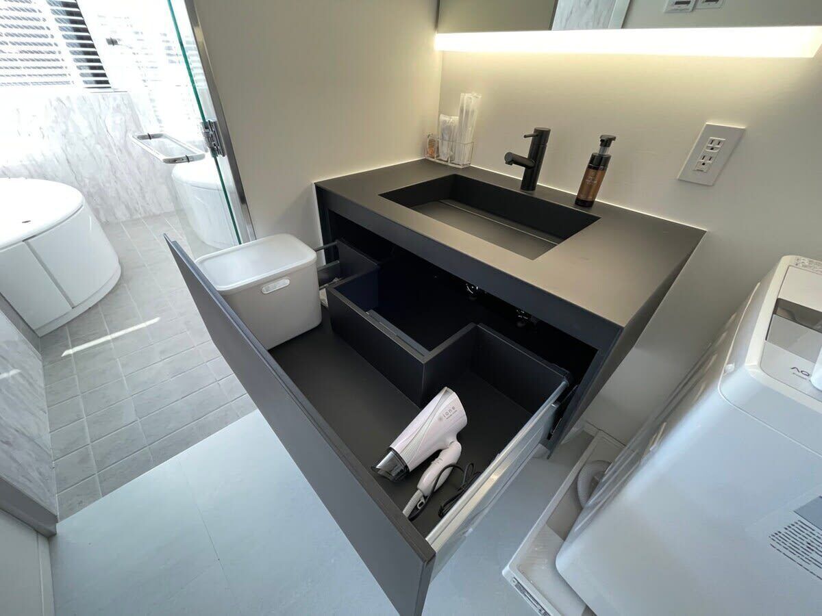 Bathtub, hair dryer, towels, soap