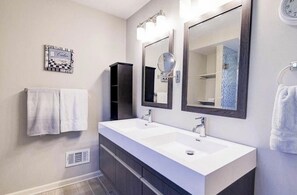 Combined shower/tub, hair dryer, towels, soap