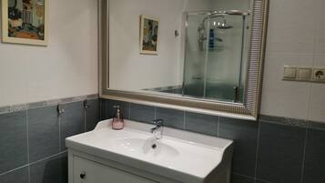 Shower, hair dryer, towels, soap