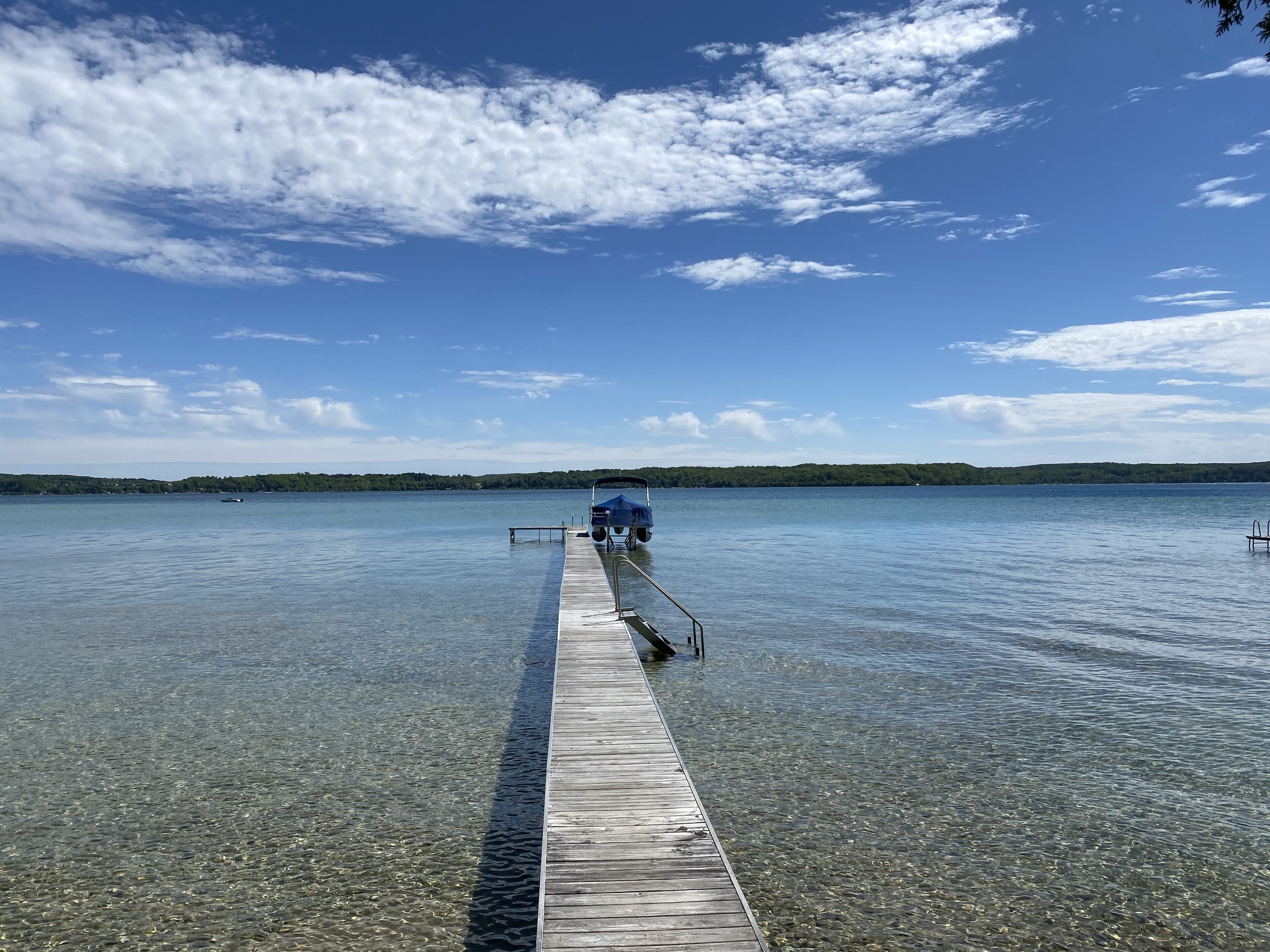 Crystal Lake Waterfront Cottage with Private Dock, Yard, & Hot Tub
