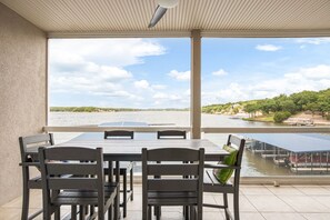 Outdoor dining - Spectacular Lands' End Condo Main Channel View! Screened-Deck Elevator Waterpark (Osage Beach)