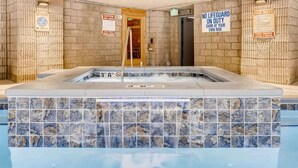 A hot tub with tiled walls and a sign indicating no lifeguard on duty. - Lake Dillon! Ampitheatre, Walk to Lake,Pool&HT (Dillon)