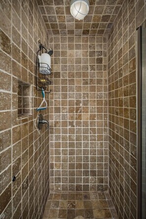 A tiled shower with a showerhead, a towel rack, and a soap dish. - Seaspray Condos - 208C (Fort Walton Beach)