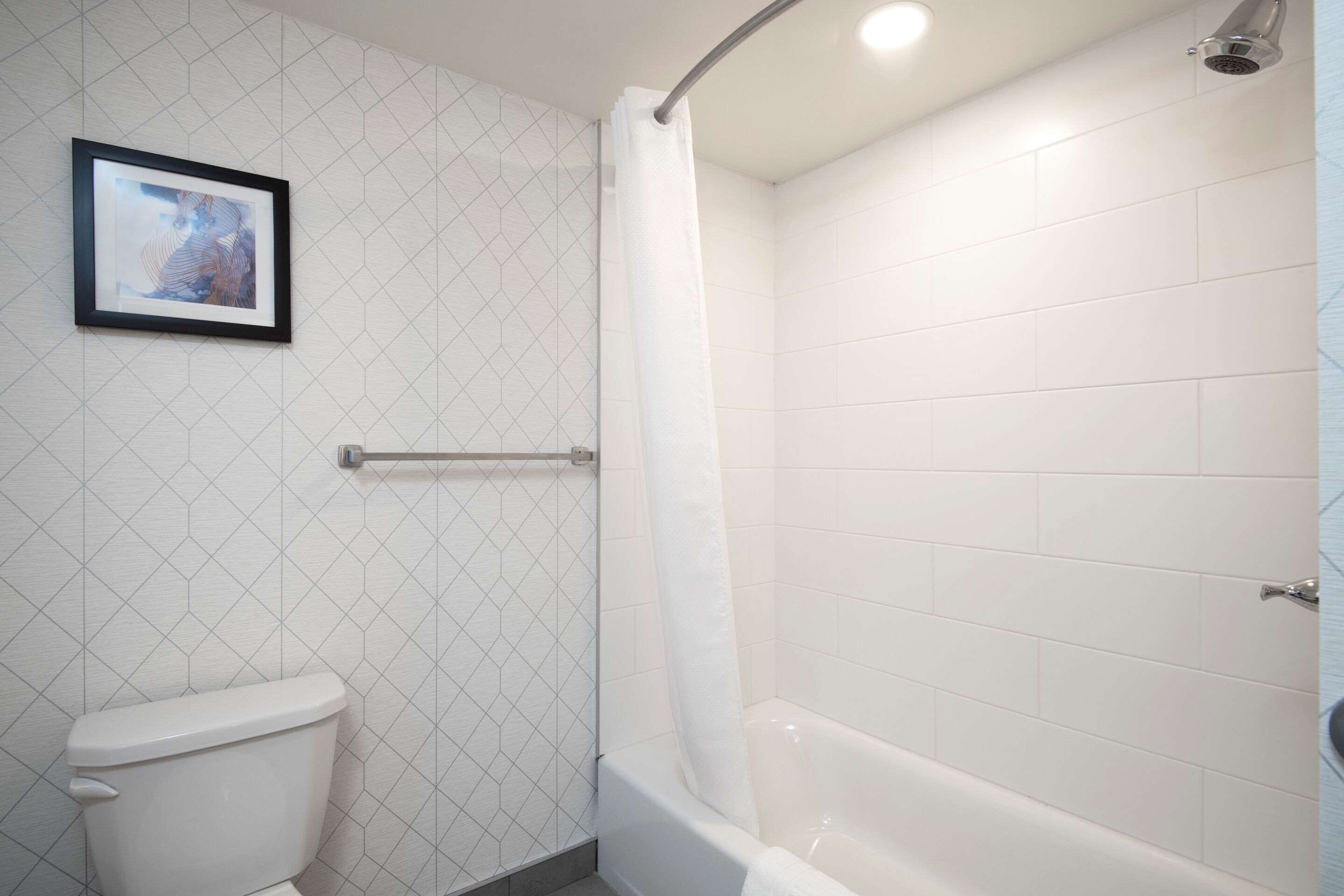 standard room, 2 queen beds, non smoking | bathroom | combined shower/bathtub, hair dryer, towels