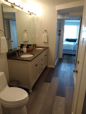 Shower, hair dryer, towels, toilet paper