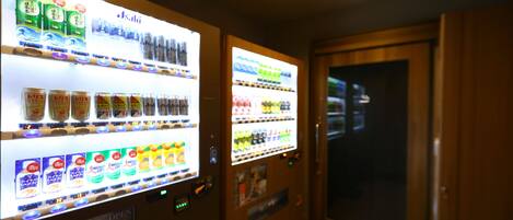Vending machines with various beverages and snacks.