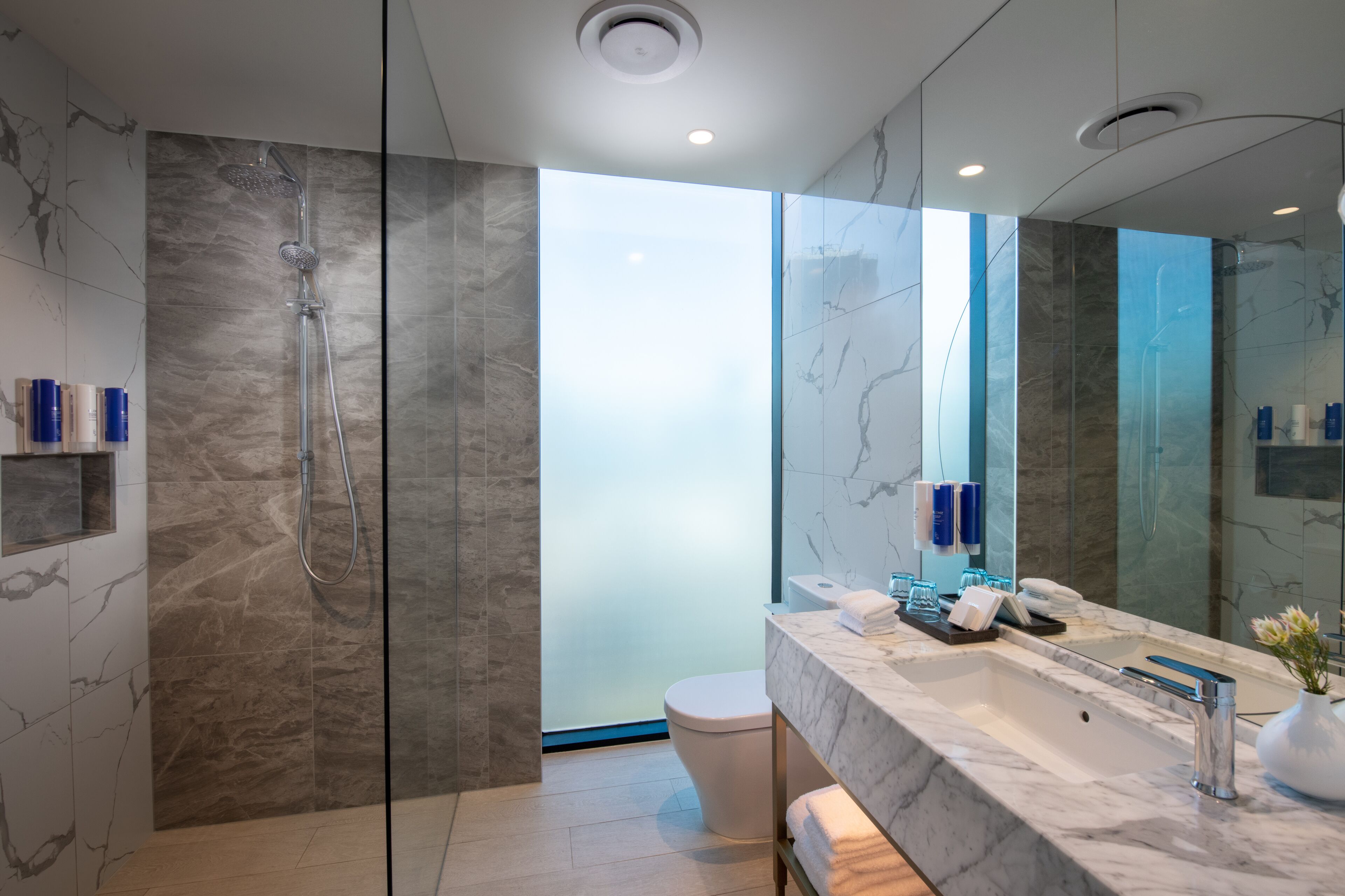 shower, rainfall showerhead, designer toiletries, hair dryer