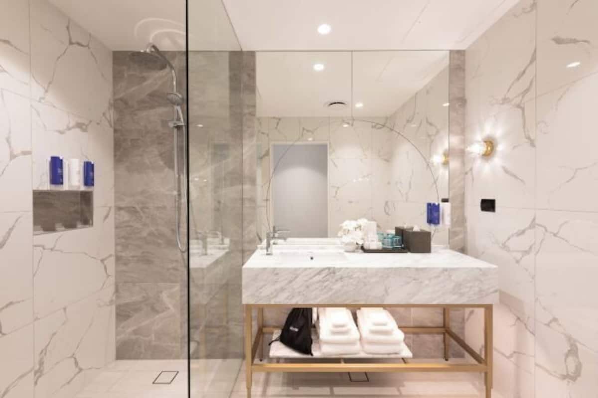 Shower, rainfall showerhead, designer toiletries, hair dryer