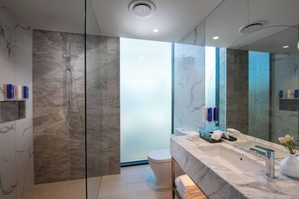 Shower, rainfall showerhead, designer toiletries, hair dryer