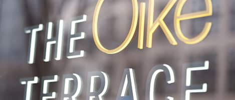 A sign with the text "THE OIKE TERRACE".
