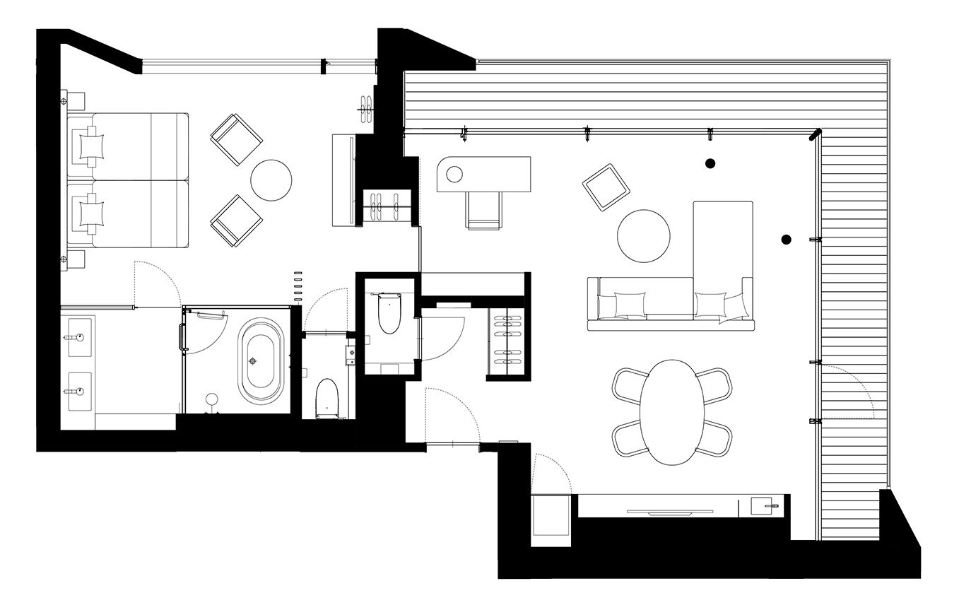 Un plan d’étage d’un hôtel comprenant une salle à manger, une cuisine, une salle de bain et un salon.
