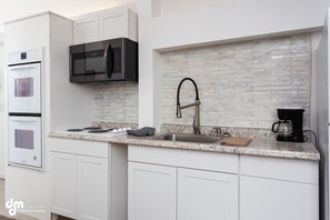 Fridge, microwave, stovetop, coffee/tea maker