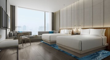 Premium bedding, down comforters, minibar, in-room safe