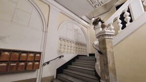 A grand staircase with ornate balustrades and a series of mailboxes on the wall. - Campo de Fiori, Navona - Fashion Domus (Roma)