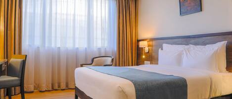 Ropa de cama de alta calidad y minibar