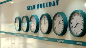 A wall with clocks set to different city times and the text "STAR HOLIDAY". - A Warmly Welcome Home to Star Holiday Hotel 34 (Istanbul)